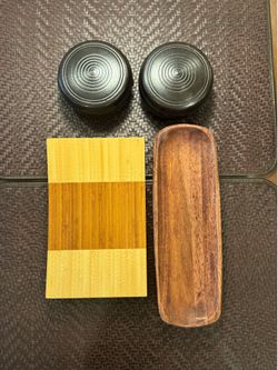 Wooden plates and clay bowls with lid