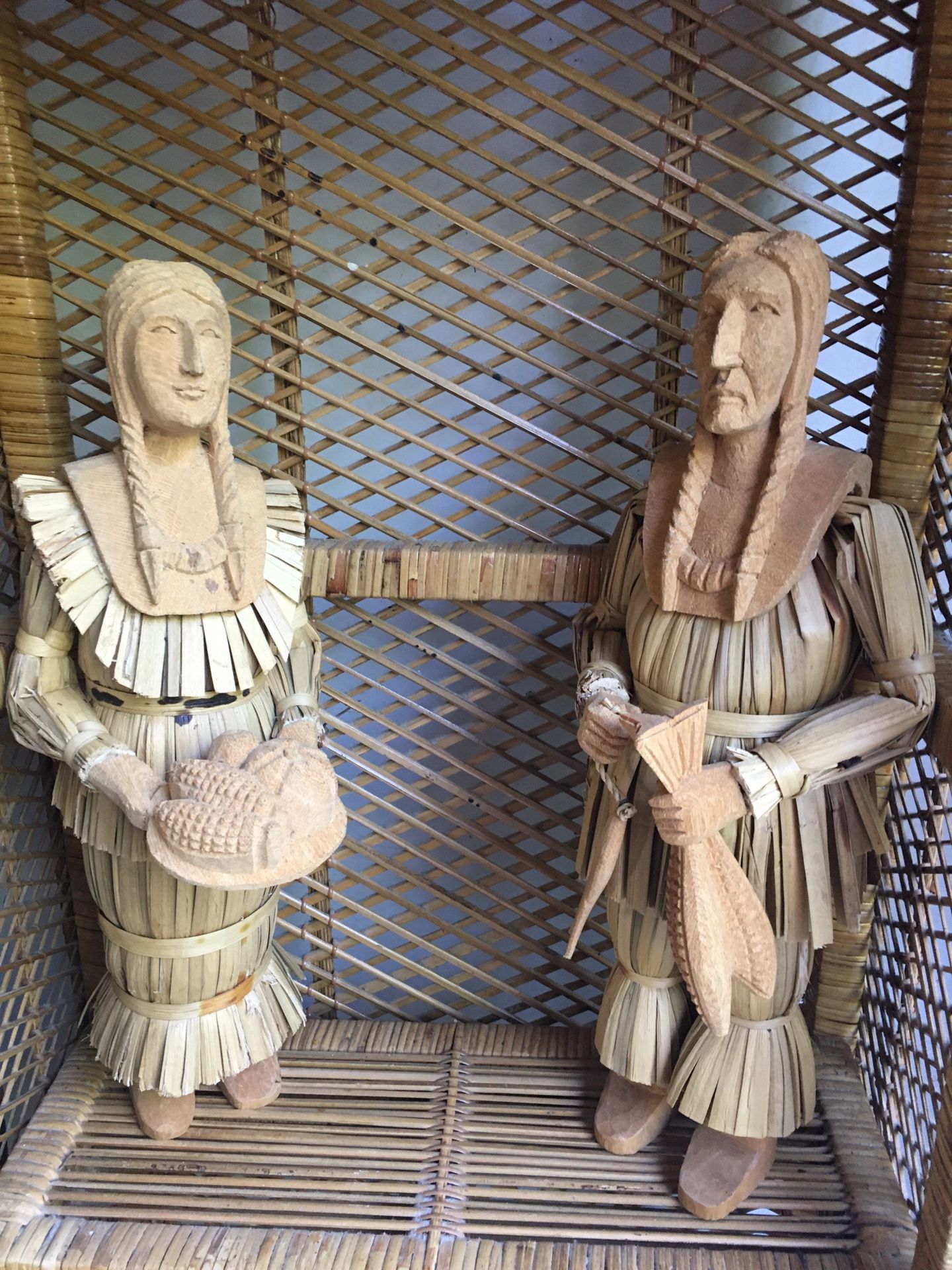 Hand carved wood and corn shuck Indian figures