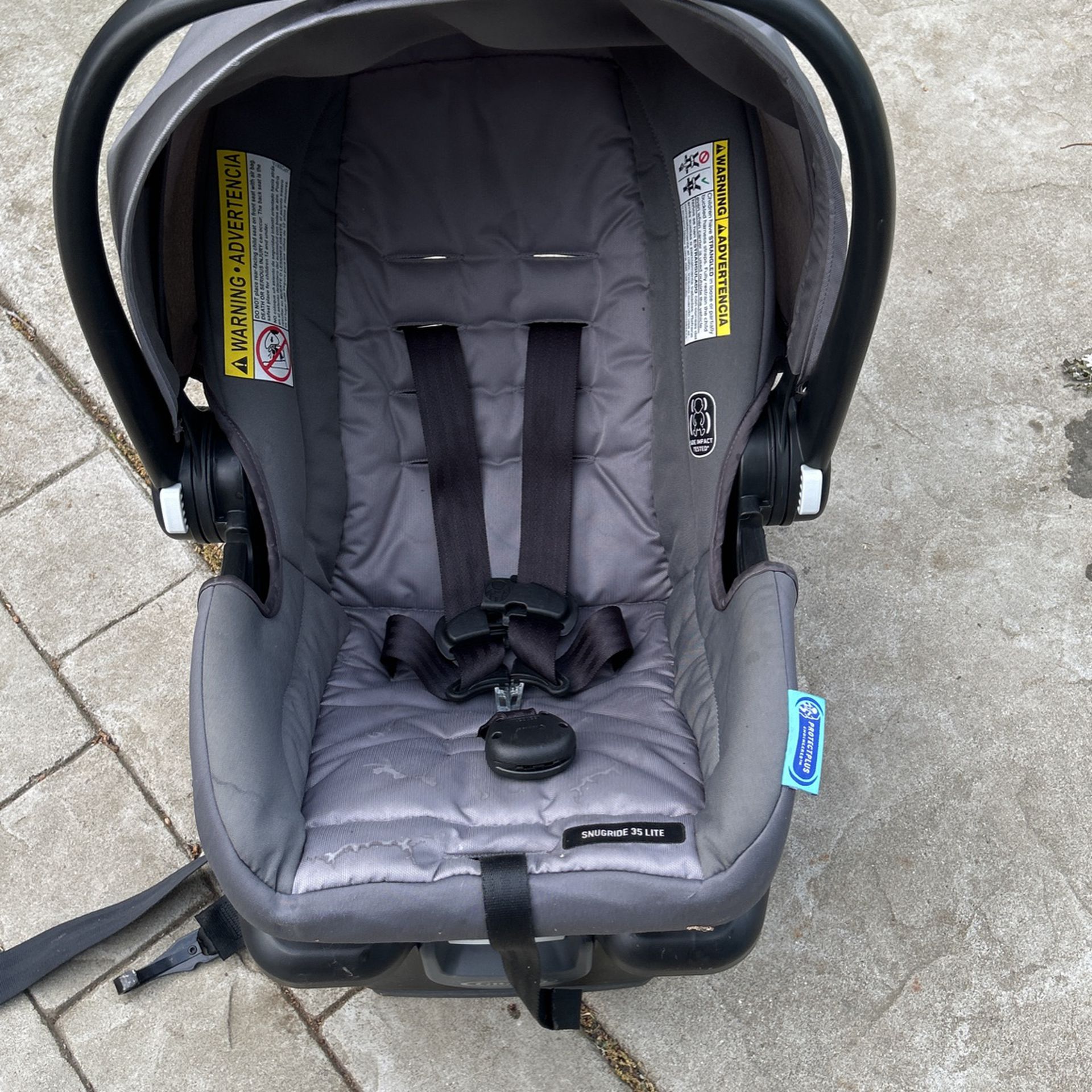 Grey Graco Snug Ride Side Impact Baby Car seat