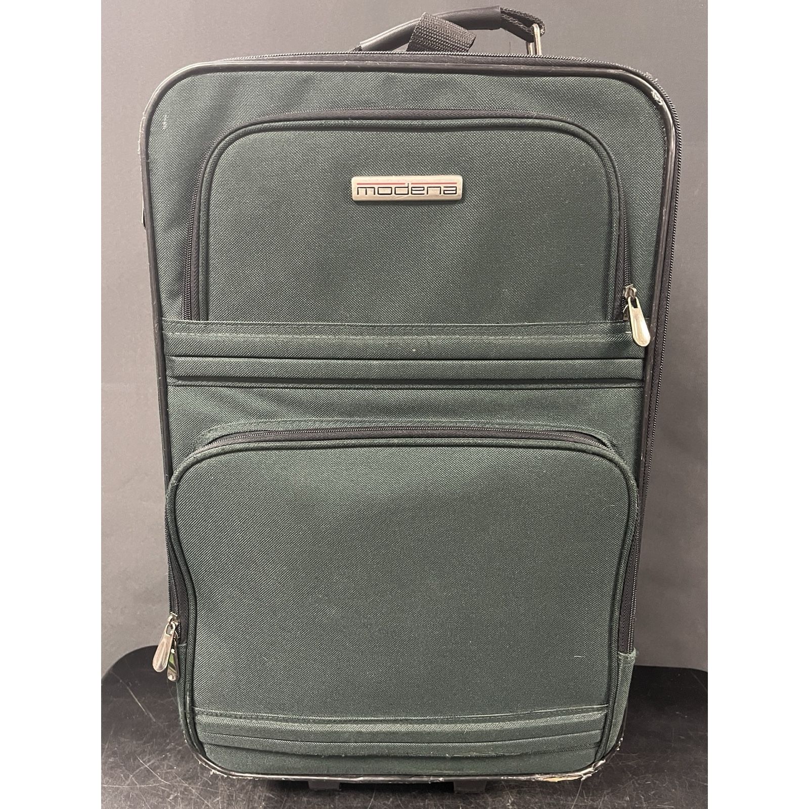 Green Modena carry on suitcase. Travel luggage. Scuffed up on outside
