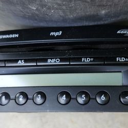 VW  Beetle AM/FM Monsoon radio with MP3 and CD player functionality.