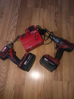 Milwaukee impact drill  whit charger $140