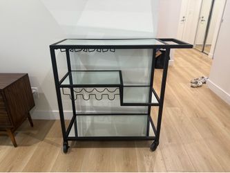 Bar cart with glass shelving