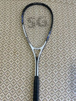 Squash racquet with balls
