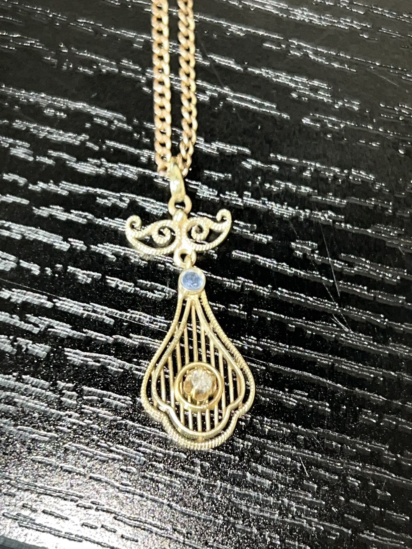 16k chain and gold pendant with possible diamond