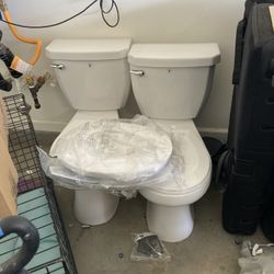 2 Glacier Bay Toilets 