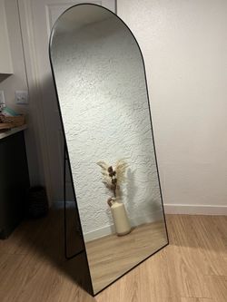 Black full length rounded mirror