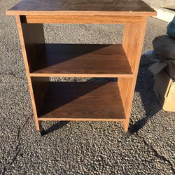 TV Table With Shelves. It Is On Caster Wheels.
