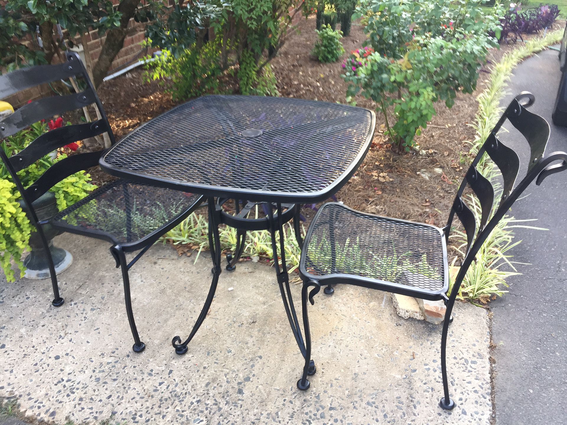 Vintage iron table with two chairs excellent condition