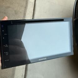 Kenwood DDX5707S monitor with a DVD receiver, a 2-DIN in-dash touchscreen car stereo that supports Apple CarPlay and Android Auto