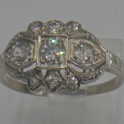 14KT WHITE GOLD ANTIQUE RING SIZE 7.5 2.3 GRAMS 1 CARAT  OF DIAMONDS STUNNING  PRE OWNED. STUNNING . ANTIQUE WITH APPROXIMATELLY 3 DIAMONDS 0.25PTS ; 