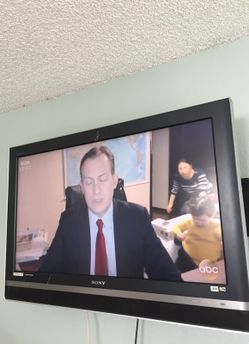 Sony 40 inch and PlayStation 2 and some game