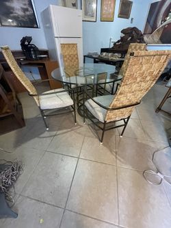 Glass Dining Table with Wicker Chairs
