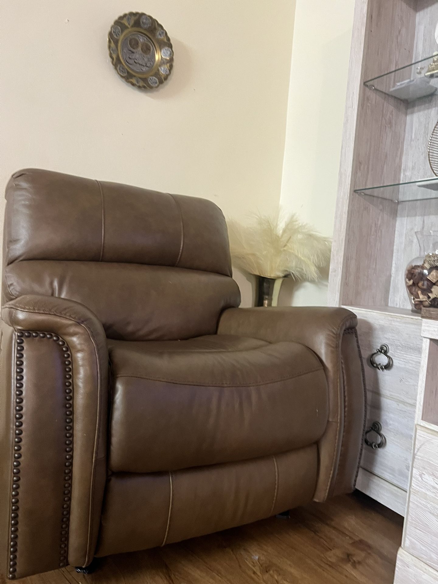 brown single reclining and rocking chair