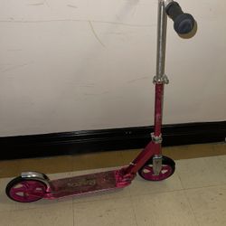 pink Razor A5 Lux Kick Scooter.  Key Features: It features extra-large urethane wheels for a smooth ride, a super-strong, height-adjustable aluminum T