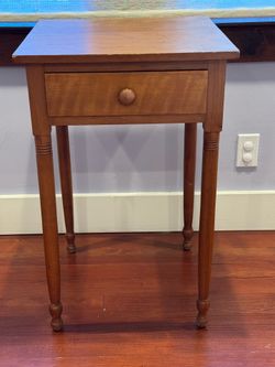 Antique cherry one-drawer nightstand with turned legs