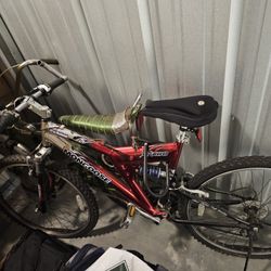 Mongoose xr100 suspension bike with helmet, gloves, lock for bike, cushion for seat and manual. Offe