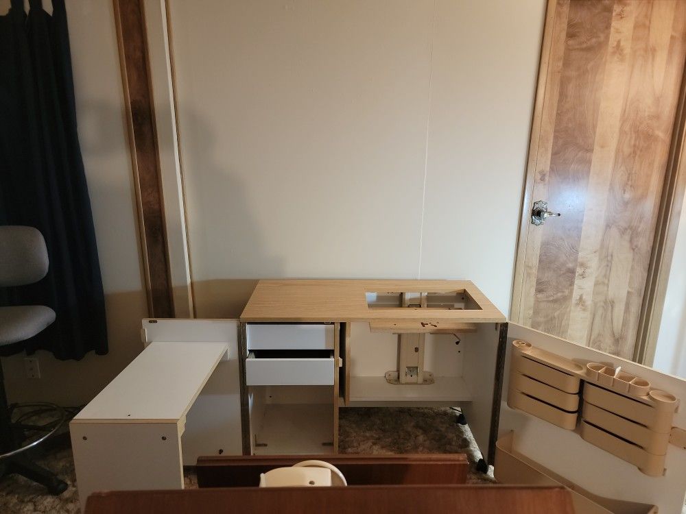Horn Sewing Cabinet Has A Table Attached