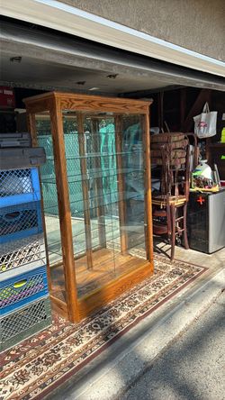 With five glass shelves, excellent condition Display case 17 inches deep 4 foot wide 75 inches high
