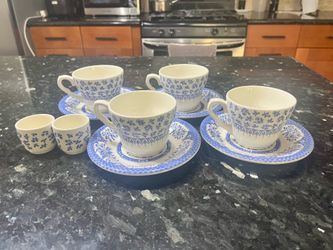 English tea cups and saucers + milk cups.  Made in England