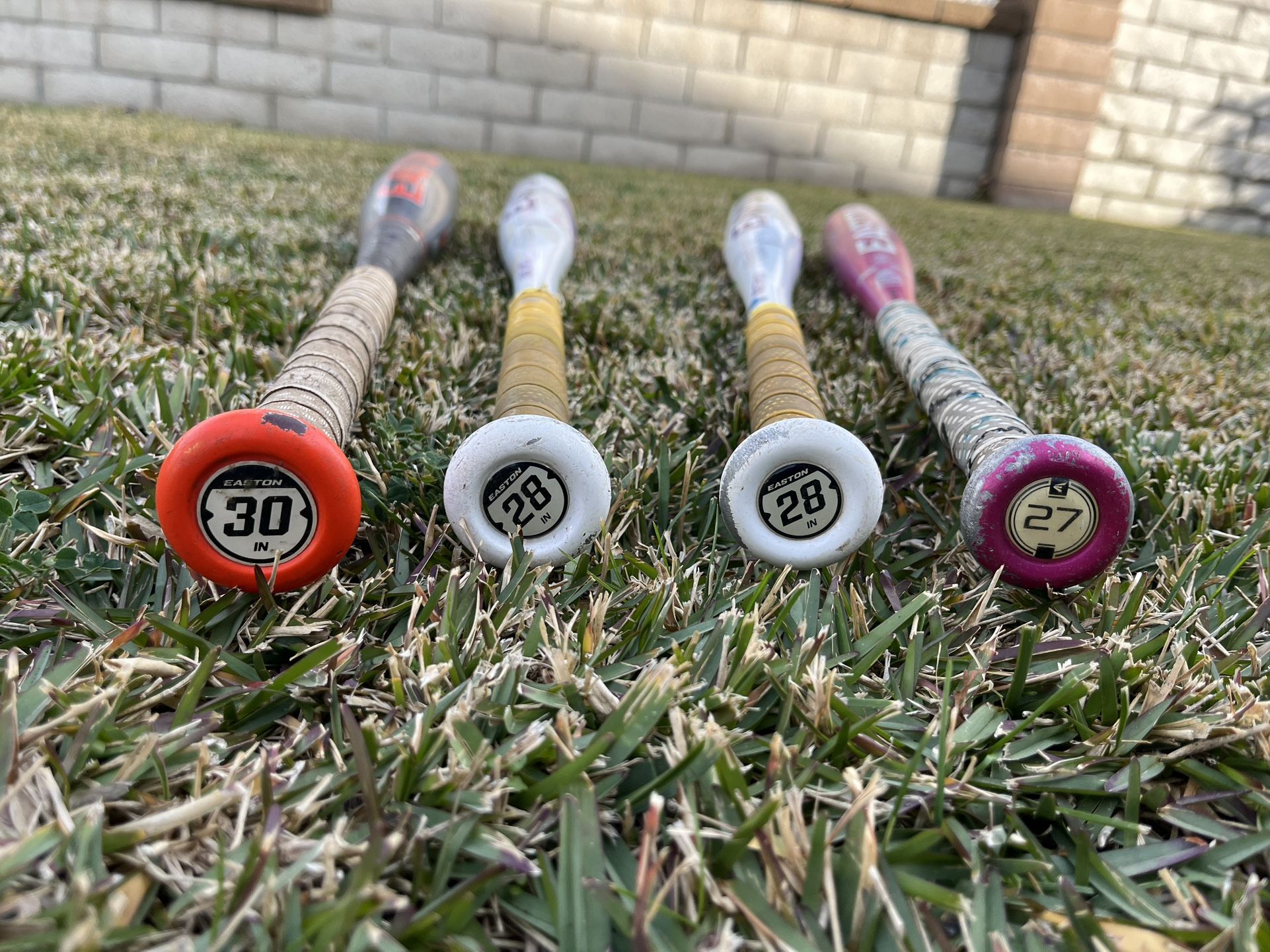 3 Softball Bats, One Baseball