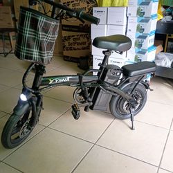 YSNA FOLDING ELECTRIC BIKE PEAK 750W. 20MPH-3 SPEED. 14IN. TIRES. RANGE 25MILES. WEIGHT CAP. 265 LBS.
