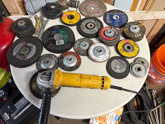 DeWalt angle grinder with various abrasive grinding, cutting ect.