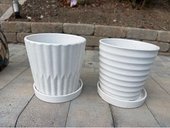 A pair of flower pots with base