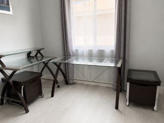 Two glass desks and two wooden drawers
