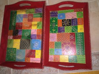 two red-and-green wooden tray