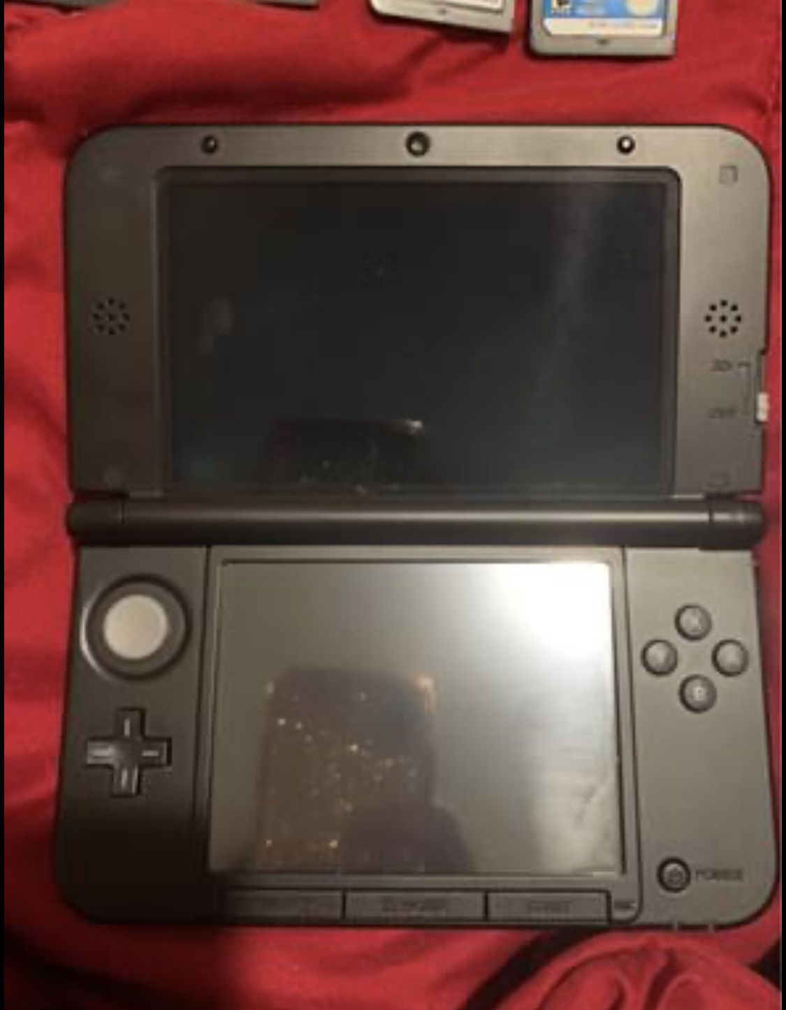 Nintendo 3DS with games and charger