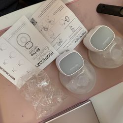 Mom cozy breast pump in half a box of breast pads