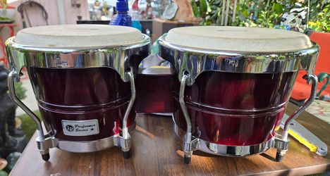 LP (Latin Percussion) Performer Series Bongos in a dark red or "Red Fade" finish with chrome hardware.