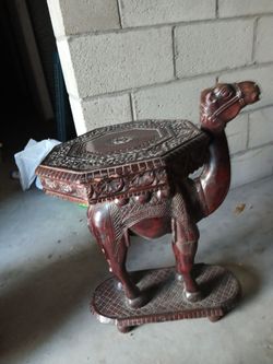 Hand carved camel end table