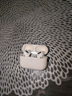 Apple AirPods Pro (1st Gen) with Wireless Charging Case.