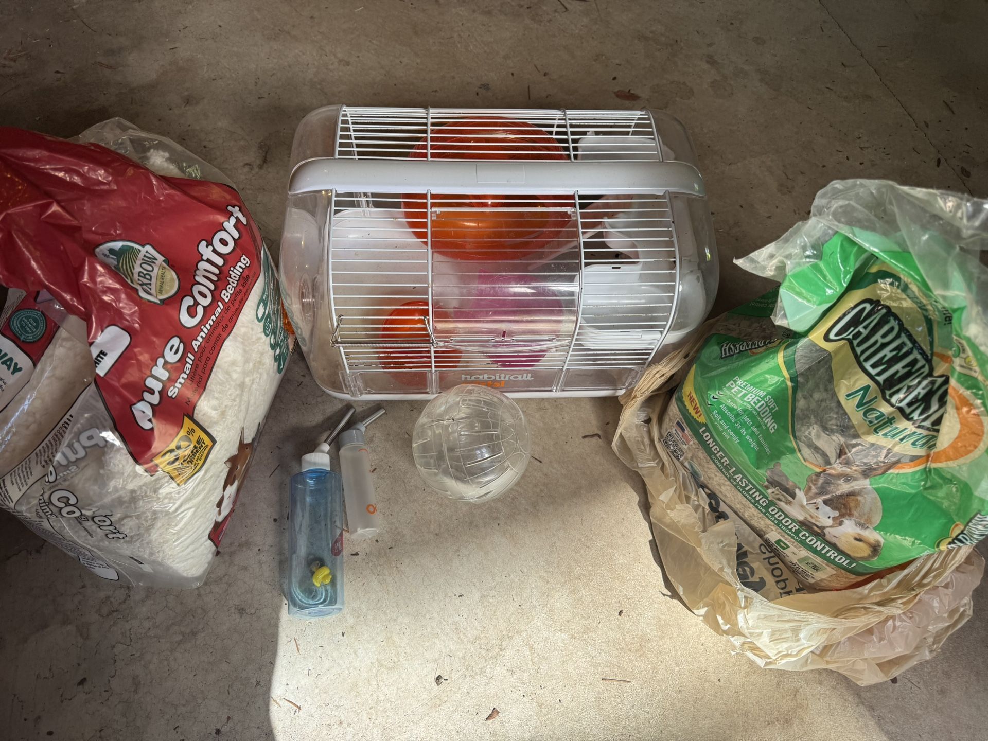 Hamster cage, ball, water bottle