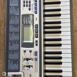 CASIO LK-100 LIGHTED KEYBOARD 61 KEYS W/LESSONS