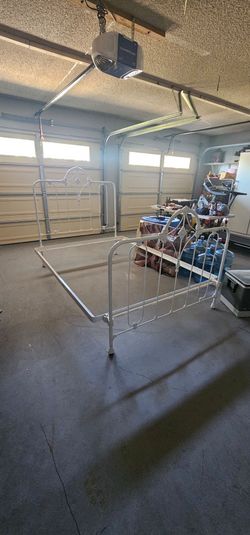 Vintage wrought iron queen bed frame.