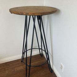 Wooden and black wrought iron high top