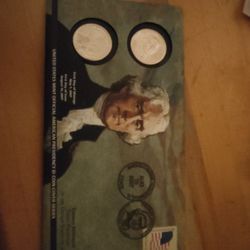 2 Thomas Jefferson $1 coins On A Display 