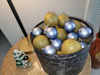 Set consisting of a cylindrical container with 34 gold and silver/lavender Christmas ornaments (featuring glossy and glitter finishes) and a small dec