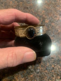 Gold-Tone Cuff Bracelet with Black Stone