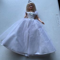 Collectible anniversary Barbie arm will charm when lifted