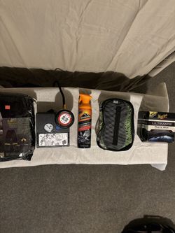 Auto cleaning kit and weather resistant rain suit.