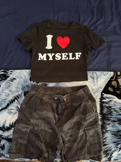 Black cropped shirt and George dark camouflage jorts.