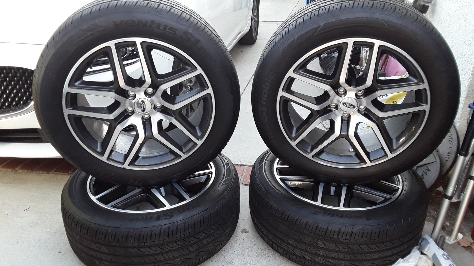 Set of new tires with rims.
