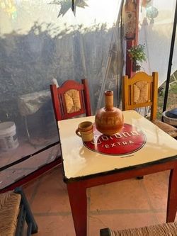 Mexican patio furniture. One table 4 chairs and one three seat bench chair