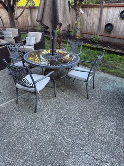 Outdoor dining table and chairs with umbrella
