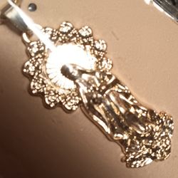 SAINT-GOLD TONE PENDANT 