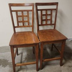 2 sturdy tall wooden dining chairs brown